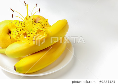tiger Lily with banana and Apple on a white background close-up. isolate 69881323