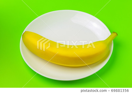 banana on a green background close-up. isolate 69881356