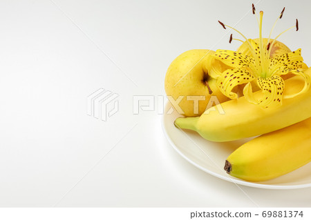 tiger Lily with banana and Apple on a white background close-up. isolate 69881374