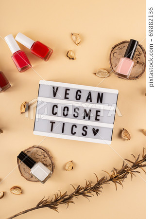 Vegan cosmetics written among bright nude polishes Vegan cosmetics written among bright nude polishes 69882136