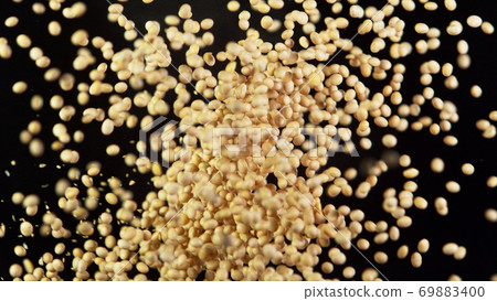 Soya raw pieces hitting up in the air 69883400