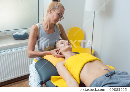 Neck and head massage in the physical therapy Neck and head massage in the physical therapy 69883925