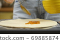 Cooking pizza. The chef prepares the pizza dough. A man or woman is engaged in home business 69885874
