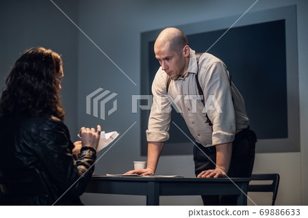 During the interrogation, the criminal tore up the document During the interrogation, the criminal tore up the document 69886633