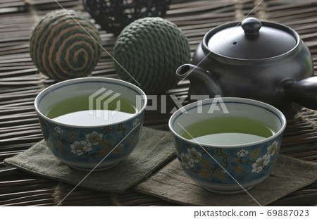 A cup of water placed on a table A cup of water placed on a table 69887023