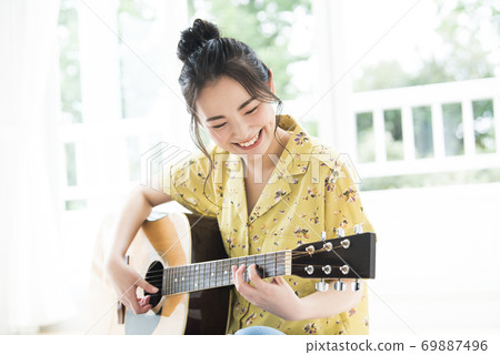 Female guitar smile Female guitar smile 69887496