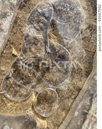 Texture, backgrounds, abstraction. Frozen puddle Texture, backgrounds, abstraction. Frozen puddle 69887982