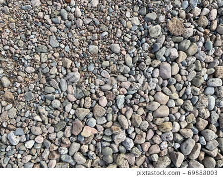 beach pebbles top view background 69888003