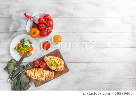 Chicken fried fillet and boiled vegetables 69889403