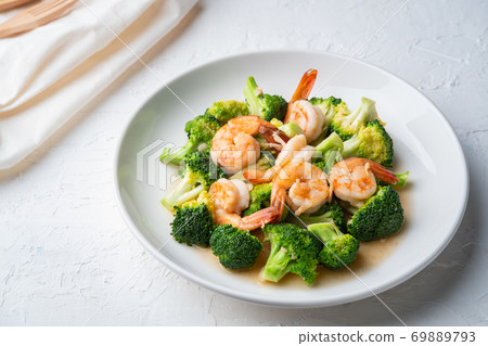 Stir Fried Broccoli with Shrimp in white plate 69889793