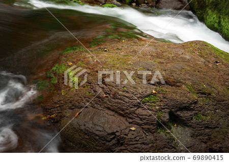 A torrent megalith in the oblique light 69890415