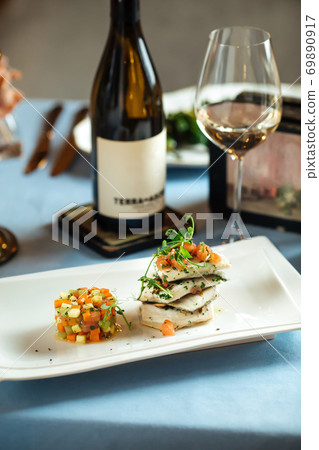 Spanish dish basque dorada with vegetable tartare Spanish dish basque dorada with vegetable tartare 69890917
