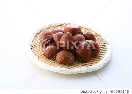 Raw Japanese chestnuts in a colander Raw Japanese chestnuts in a colander 69891146