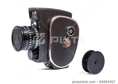 Vintage movie camera isolated on white. With clipping path. Vintage movie camera isolated on white. With clipping path. 69893467