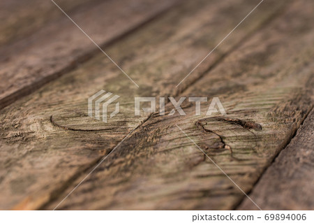 Old wooden plank background with selective focus.  69894006