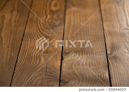 Old wooden plank background with selective focus. Old wooden plank background with selective focus. 69894007