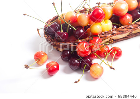 Yellow and red sweet cherry in basket isolate on white. Yellow and red sweet cherry in basket isolate on white. 69894446