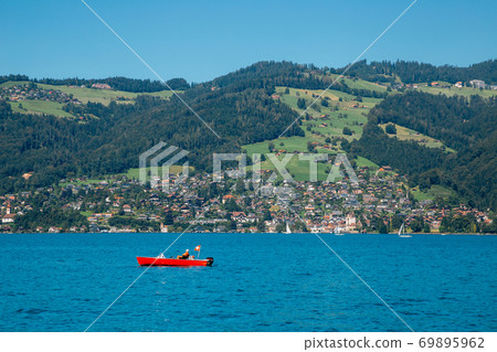 Thun lake and alps mountain village in Switzerland 69895962