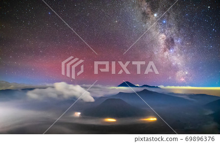 Bromo volcano with milky way, the moon and sand strom Tengger Semeru national park, East Java, Indonesia 69896376