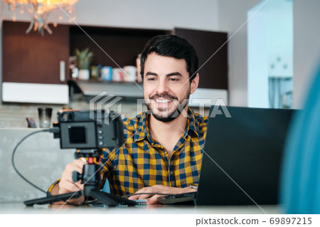 Young Man Working From Home Making Business Web Conference Young Man Working From Home Making Business Web Conference 69897215