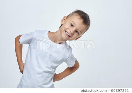 attractive boy posing in a Studio on a white background 69897231
