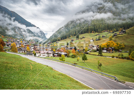 Road along some small village. 69897730