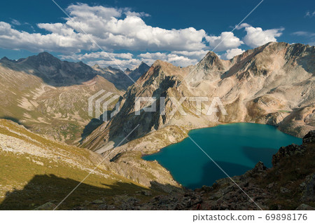 Day landscape mountain lake high in the mountains against the background of the Caucasian highlands in the North Caucasus 69898176