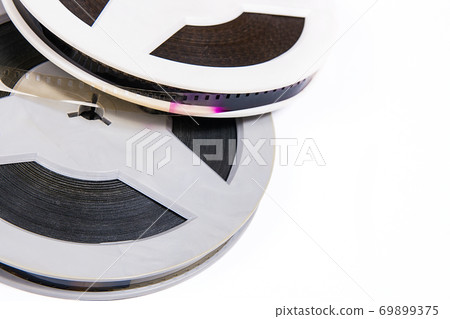 Close up view of old cine film strip isolated on white background. 69899375