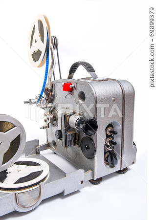 Vintage motion picture film projector and reel of motion picture film isolated on a white background. Vintage motion picture film projector and reel of motion picture film isolated on a white background. 69899379