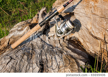 Fishing rod and reel on the natural background. Fish stringer. 69899406