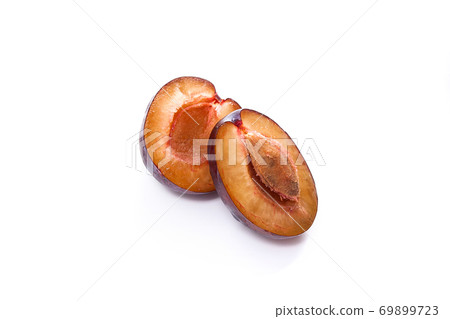 Half of ripe plum isolated on white background.. 69899723