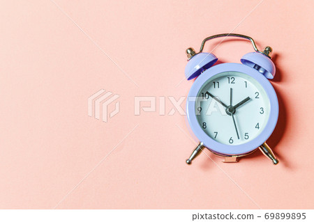 Simply minimal design ringing twin bell vintage classic alarm clock Isolated on pink pastel background. Rest hours time of life good morning night wake up awake concept. Flat lay top view, copy space Simply minimal design ringing twin bell vintage classic alarm clock Isolated on pink pastel background. Rest hours time of life good morning night wake up awake concept. Flat lay top view, copy space 69899895