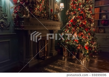 Classic christmas New Year decorated interior room New year tree with silver and red ornament decorations Classic christmas New Year decorated interior room New year tree with silver and red ornament decorations 69899896