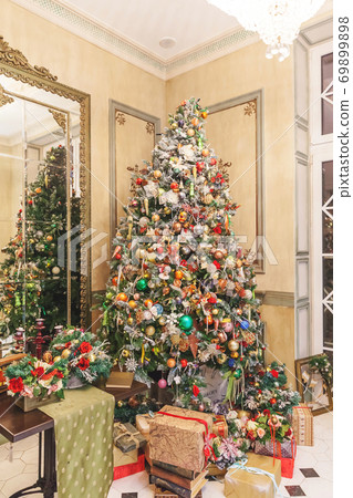 Classic christmas New Year decorated interior room New year tree with silver and red ornament decorations 69899898