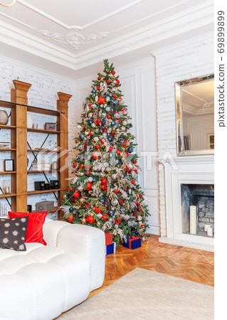 Classic christmas New Year decorated interior room New year tree with silver and red ornament decorations 69899899