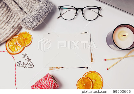 Christmas flat lay composition with candle, dry oranges and other 69900606
