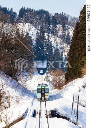 Rikuu West Line train running on the snow Shinjo City, Yamagata Prefecture 69901432