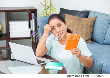 Senior woman worried about having a pension book Senior woman worried about having a pension book 69902506