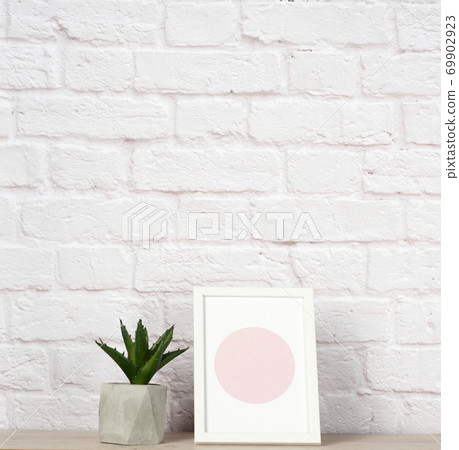 empty photo frame, aloe in a white ceramic pot, 69902923