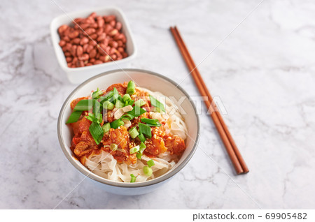 shan noodles with peanuts and chopsticks at white marble tabletop. burmese cuisine traditional dish 69905482