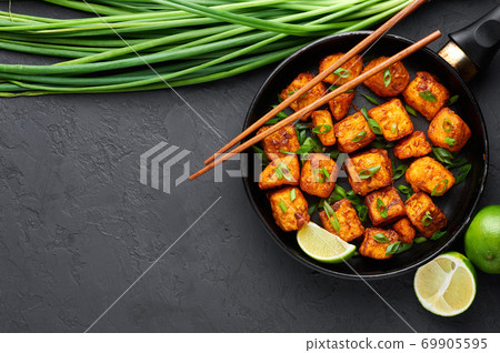 Paneer Manchurian or Paneer 65 in pan at black slate backgrund Paneer Manchurian or Paneer 65 in pan at black slate backgrund 69905595