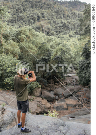 photographer takes pictures of the forest photographer takes pictures of the forest 69905646