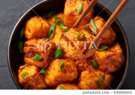 Paneer Manchurian or Paneer 65 in bowl at black slate background. Close up Paneer Manchurian or Paneer 65 in bowl at black slate background. Close up 69906008