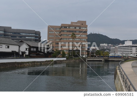 A tram that runs through a historic town 69906581