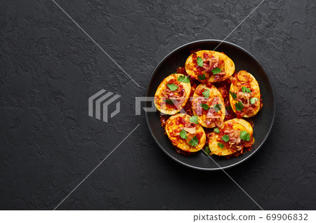 Golden Egg Curry in black bowl on dark slate background. Burmese Egg Curry is Myanmar Cuisine dish Golden Egg Curry in black bowl on dark slate background. Burmese Egg Curry is Myanmar Cuisine dish 69906832
