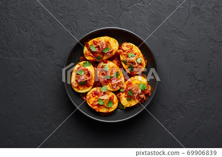 Golden Egg Curry in black bowl on dark slate background. Burmese Egg Curry is Myanmar Cuisine dish Golden Egg Curry in black bowl on dark slate background. Burmese Egg Curry is Myanmar Cuisine dish 69906839