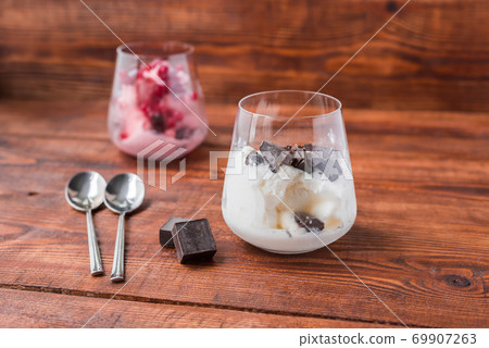 Sweet desert with ice cream, chocolate and berries 69907263