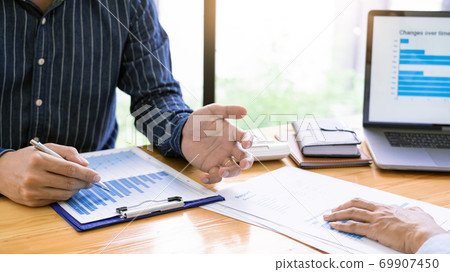Business Corporate meeting using laptop at conference table discussing ideas for their business project in modern office. Business Corporate meeting using laptop at conference table discussing ideas for their business project in modern office. 69907450