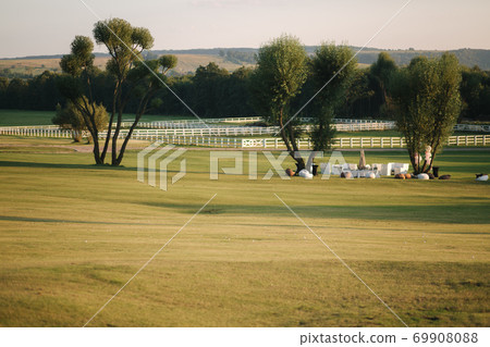 Golf course in cuntryside. Sun set in summer evening 69908088