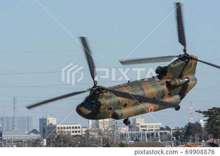 Self-Defense Forces helicopter flying around in a demonstration 69908876